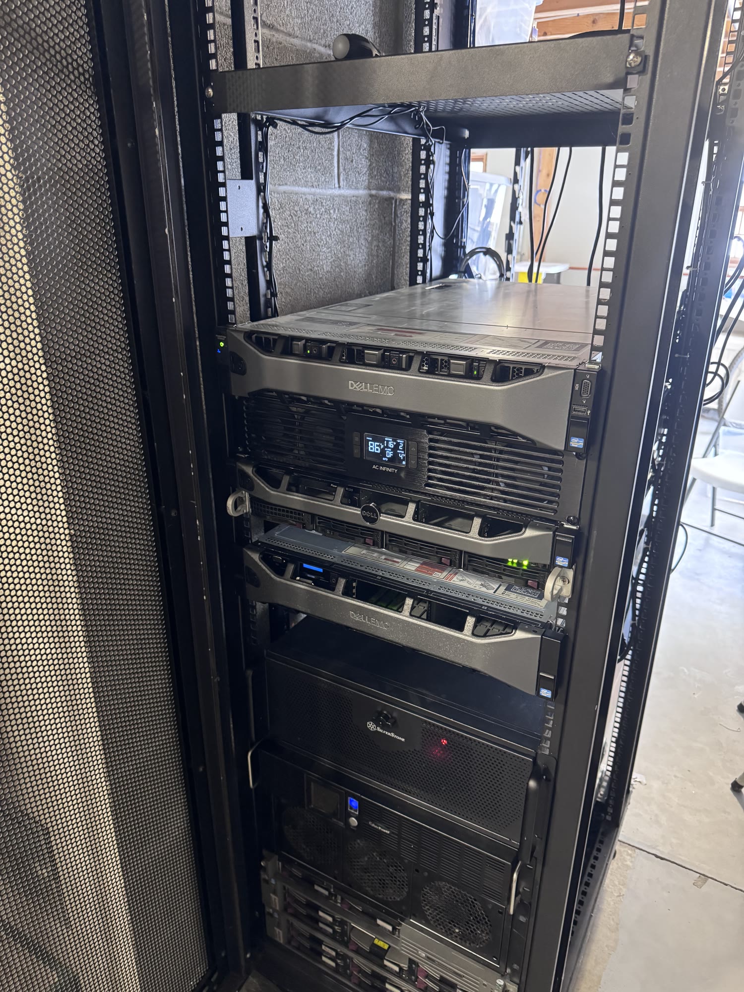 Jack Pala's personal 42U server rack containing multiple rack-mounted servers and supporting infrastructure